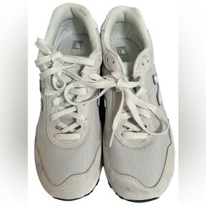 New Balance Grey / White athletic sneakers.